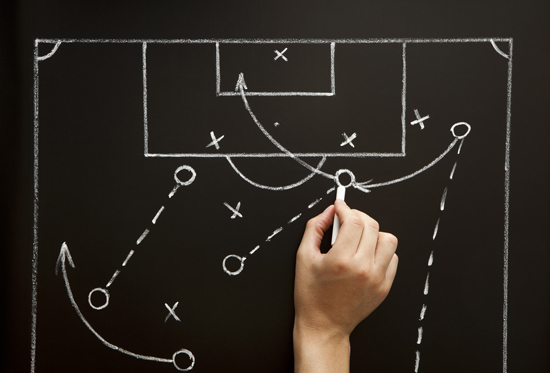 Man drawing a soccer game strategy
